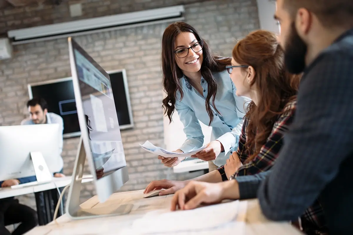 Group of professionals working in the office with leased line for business supplied by UltraviewX