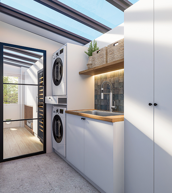 A bright and functional utility room featuring custom white cabinetry, a spacious sink, and a designated area for washing dogs.