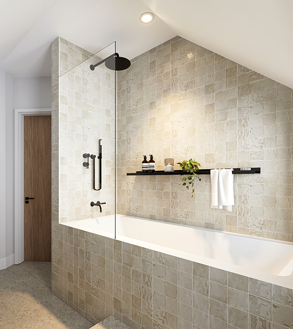 A bathroom with a relaxing bathtub and Moroccan-inspired tiles. The palette and natural materials create a timeless design.